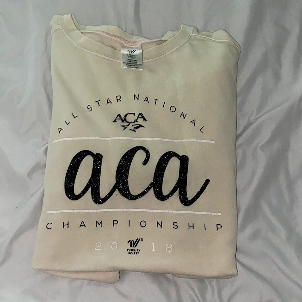 varsity spirit crew neck, size Large, good condition, cream color